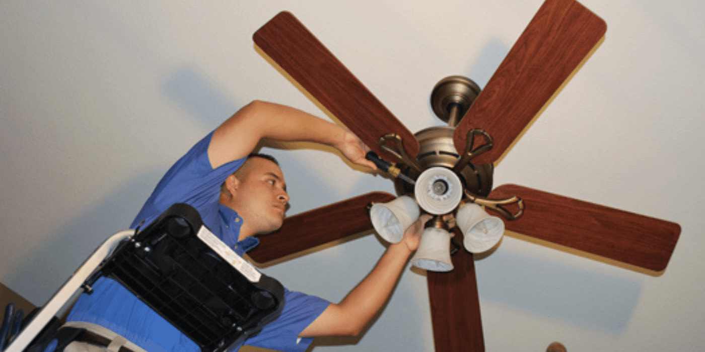 a licensed electrician fixing a homeowner’s lights