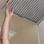 a homeowner replacing an air filter