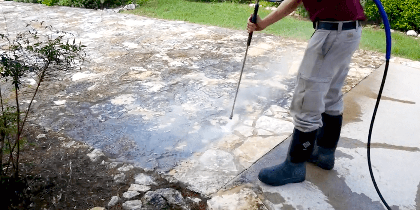 specialists power washing an Austin home