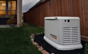 Generac brand generator along a fence