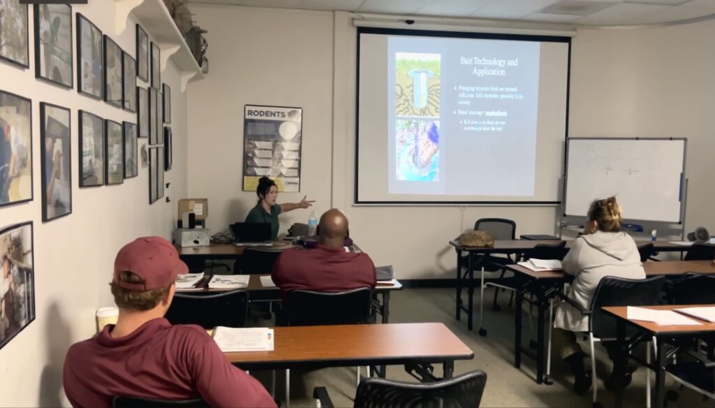 A training manager teaching a pest management class at ABC