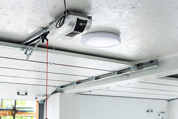 open garage door with garage light in Austin, TX