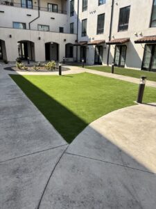 a courtyard with artificial turf