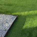 artificial turf around flowerbed in college station