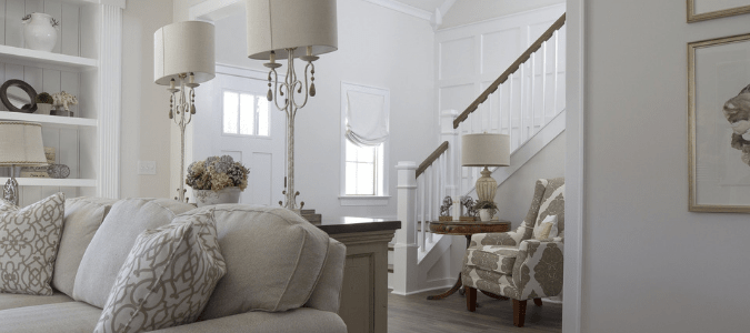 A white and gray living room and entryway