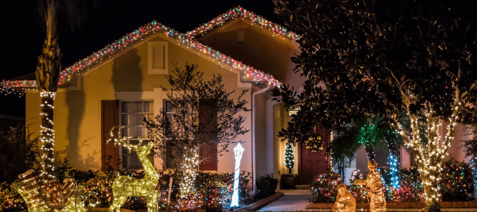 A home that has been decorated with multiple strands of lights, which may make the homeowner wonder if Christmas lights use a lot of electricity