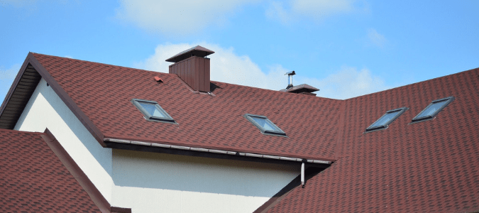 A home with roof peaks which makes a homeowner wonder how to hang lights on a roof peak