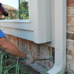 a plumber cleaning a homeowner’s drains