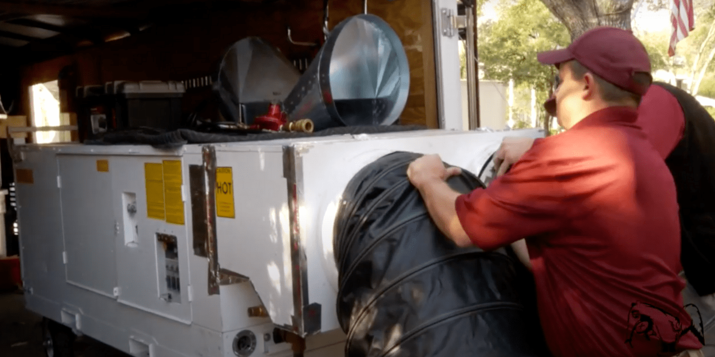 specialists setting up bed bug heat treatment for a homeowner