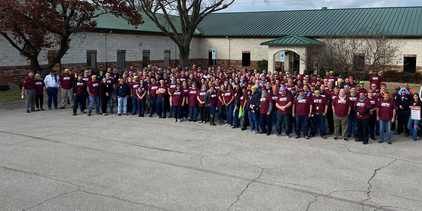 all of the ABC staff standing outside of the Dallas office building