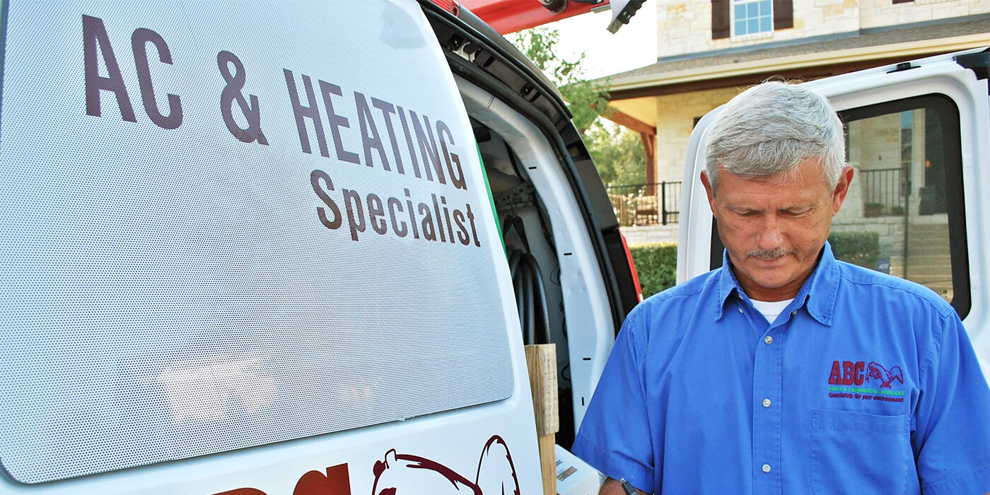 an HVAC specialist writing a report on a homeowner’s heating and cooling system