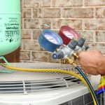 an ABC HVAC Contractor diagnosing an air conditioning unit