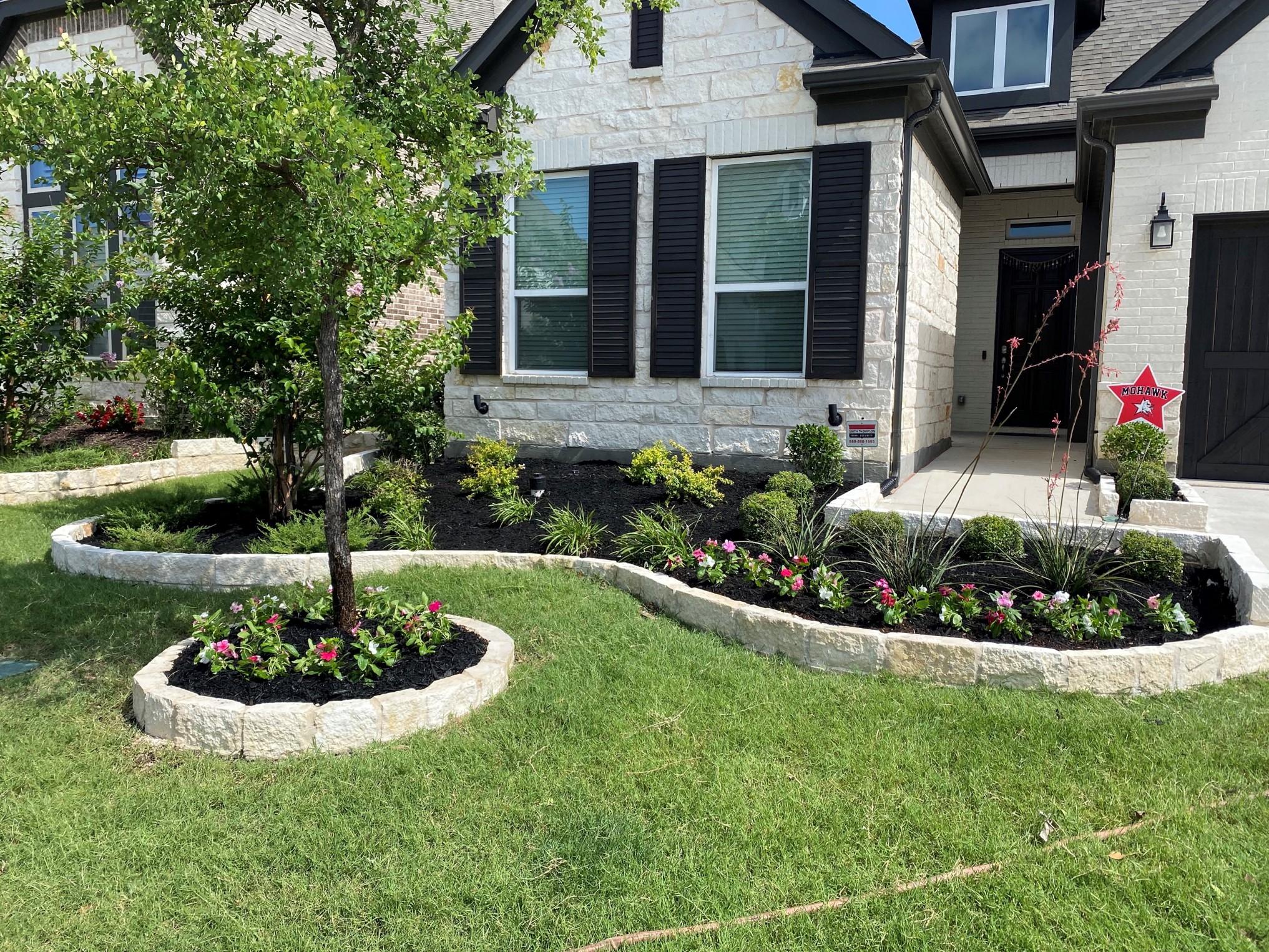 ABC landscaping professionals updating homeowners’ front yards with new plants and pavers