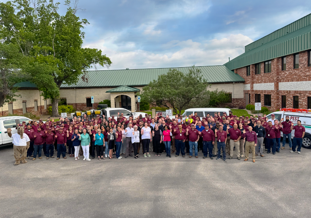 Group of ABC employees waving