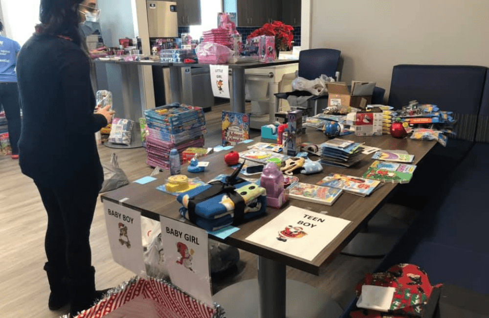 an ABC team member volunteering at a Toy Drive put on by the Child Advocacy Center of Denton County