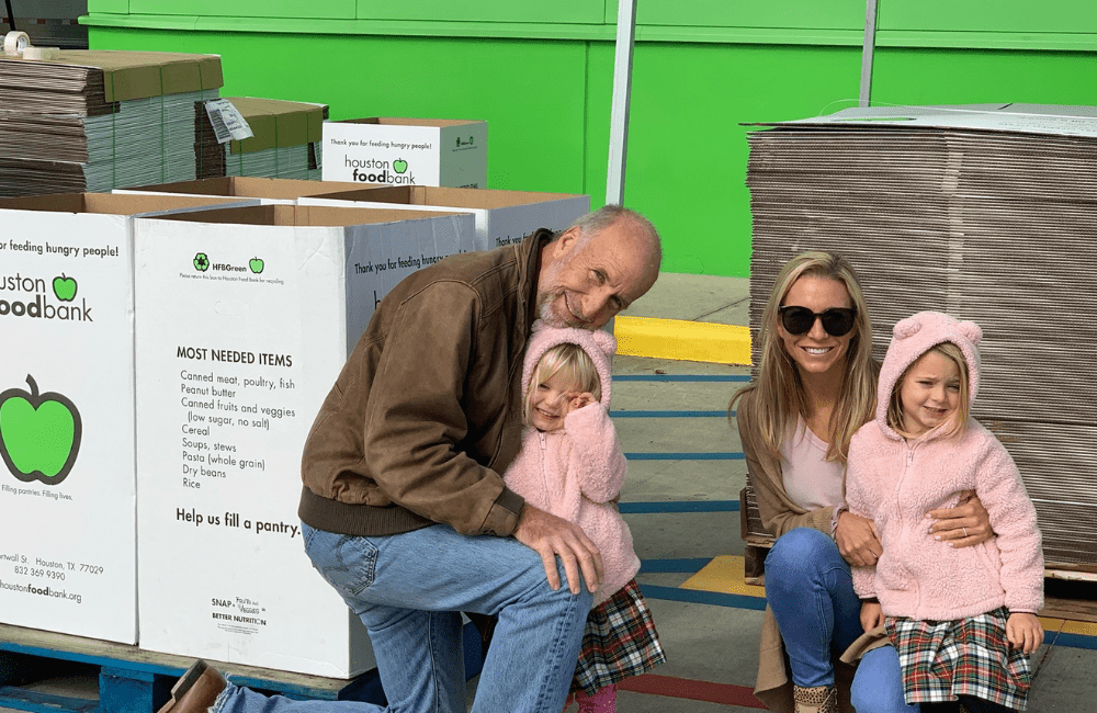 Raleigh Jenkins with his daughter and granddaughters volunteering at the Houston Food Bank