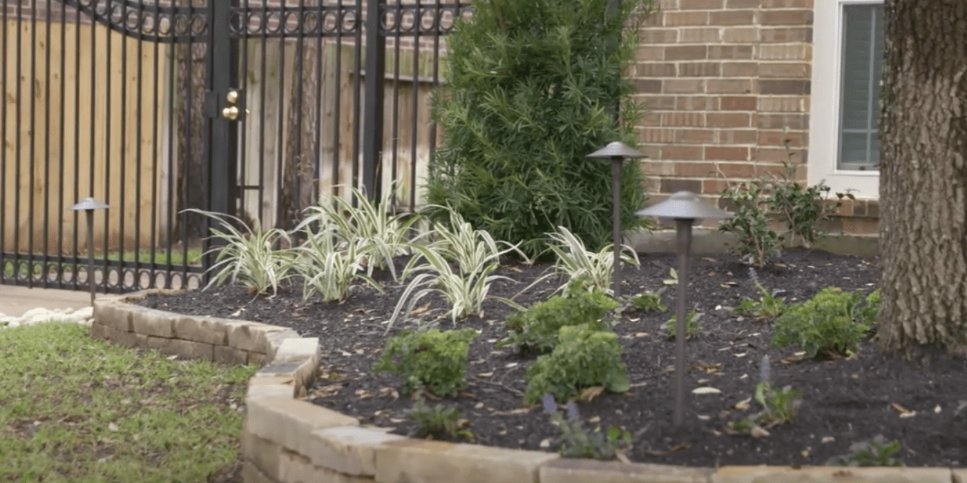 ABC landscaping professionals updating homeowners’ backyards with new plants and pavers