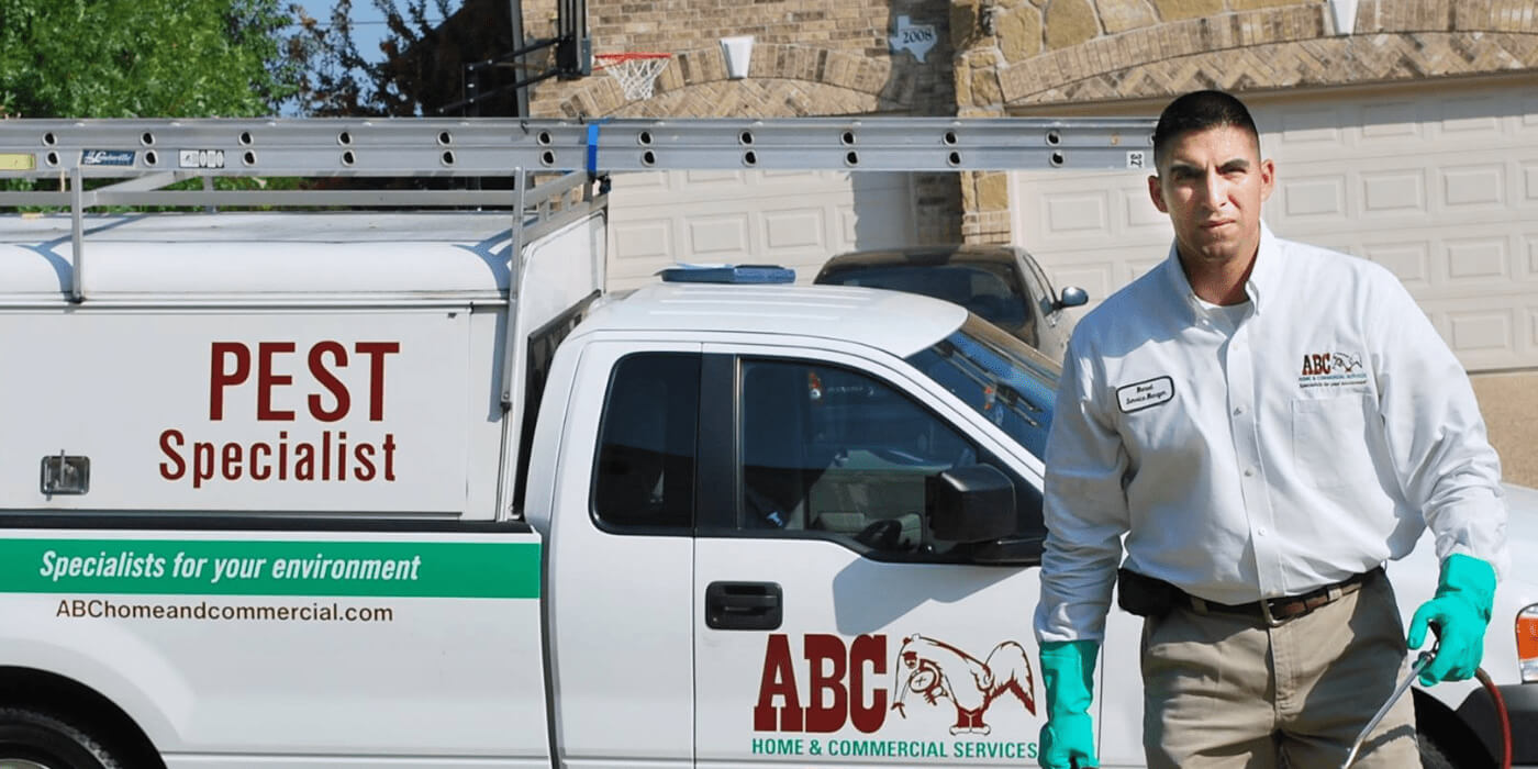 an ABC pest control specialist arriving at a home for treatment