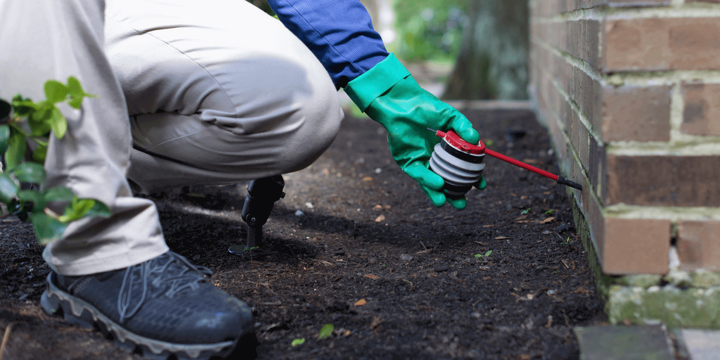 an ABC specialist treating a home for fire ants