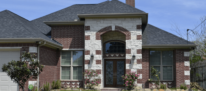 a brick house with tall windows