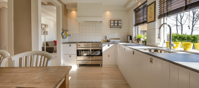 a kitchen with white cabinets