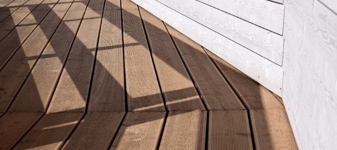 a clean wooden deck that was recently pressure washed