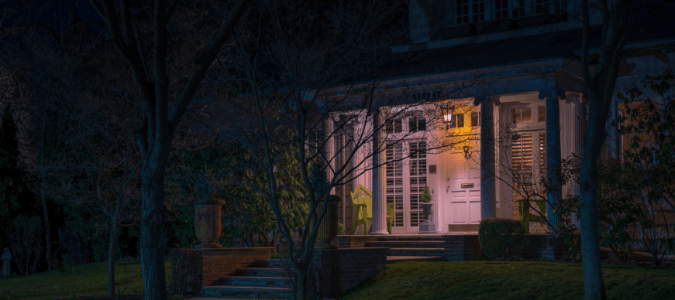 the front yard of a home at night