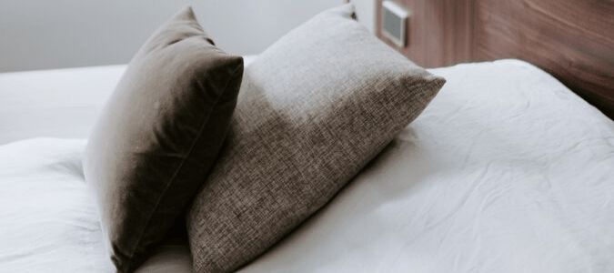 a freshly made hotel bed