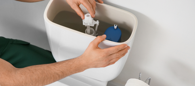 looking at a toilet's tank