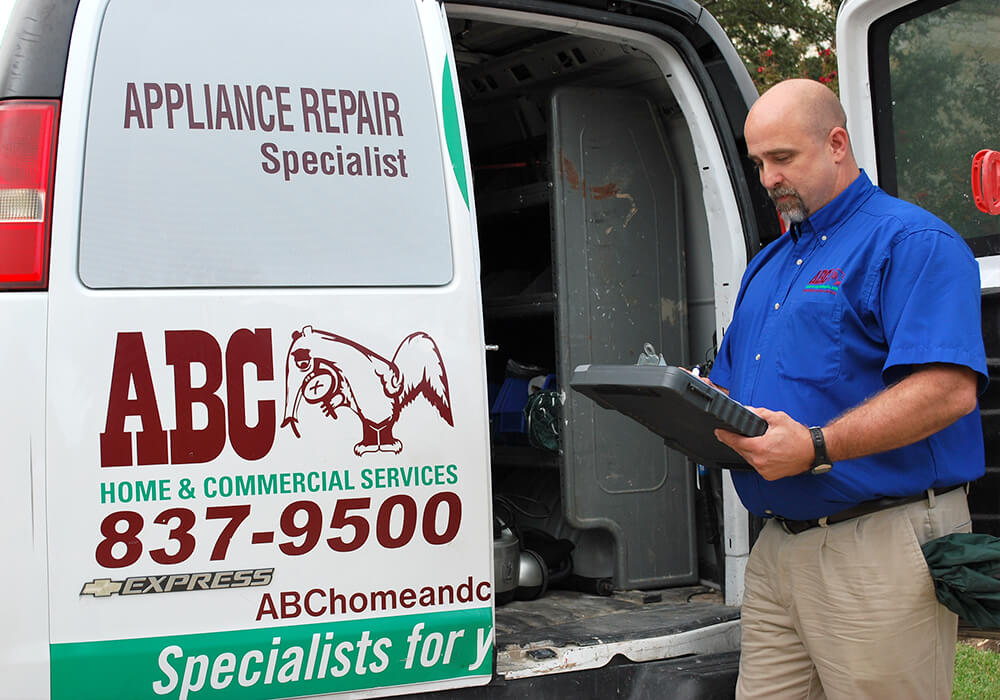 an ABC appliance repair specialist writing recommendations for commercial services