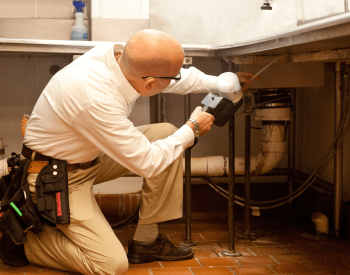 ABC pest control specialists performing an inspection and treating for pests