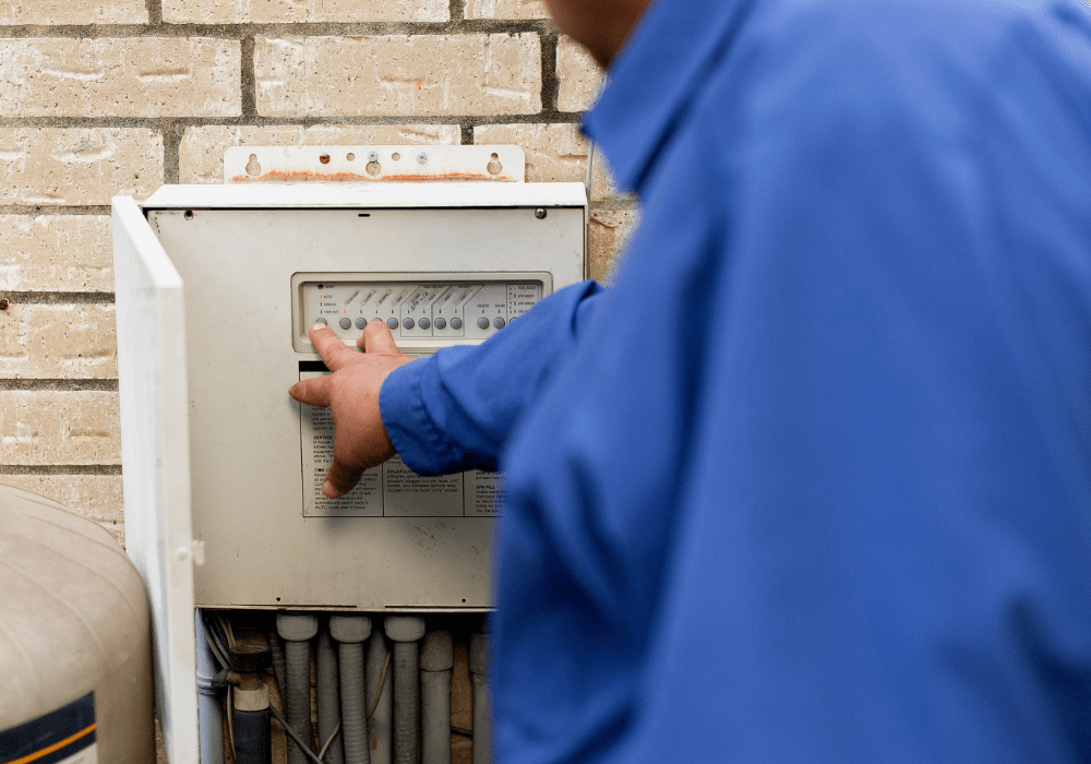 a ABC specialist checking the control panel of a pool