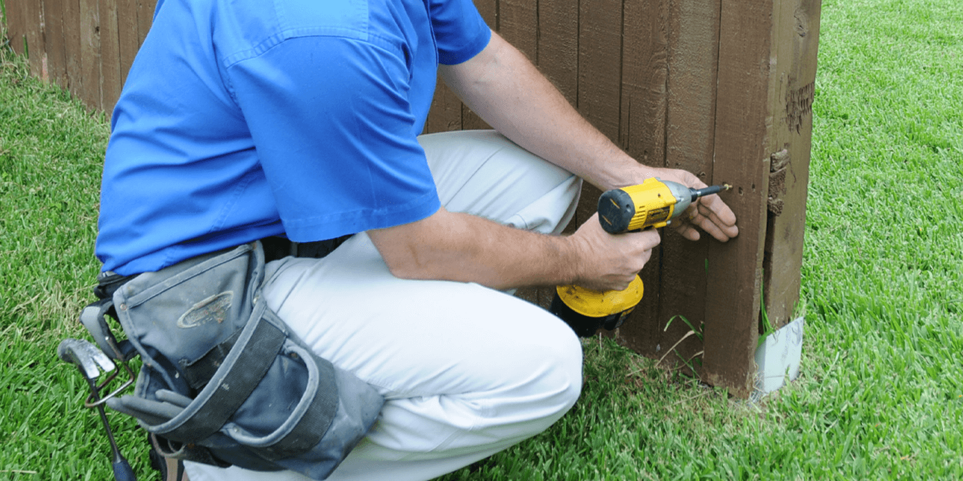 a handyman installing a new door for a customer