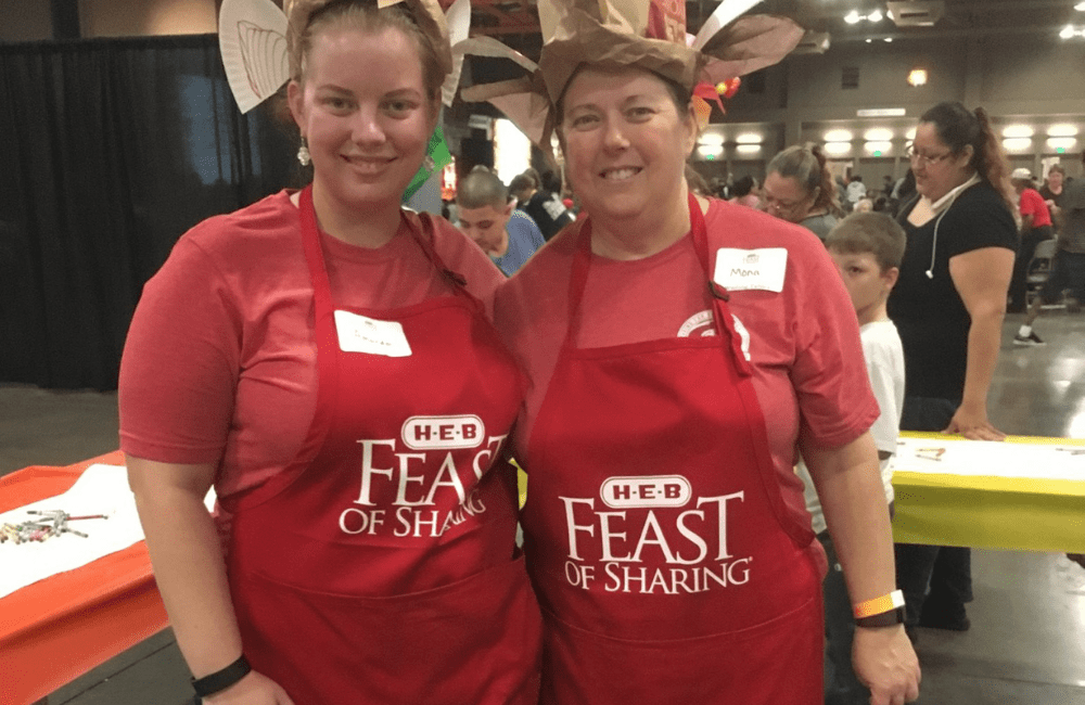 two ABC team members volunteering at an event for United Way