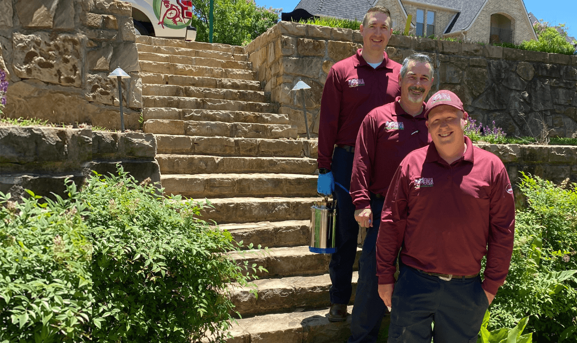 An ABC pest control specialist performing preventative pest control services for a homeowner