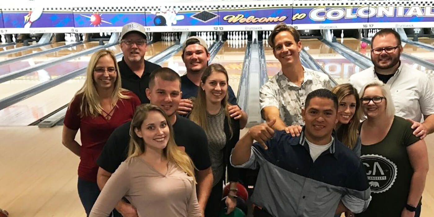 a group of ABC employees bowling together