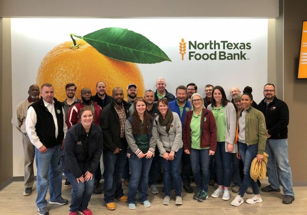 Dennis with ABC employees volunteering at the North Texas Food Bank