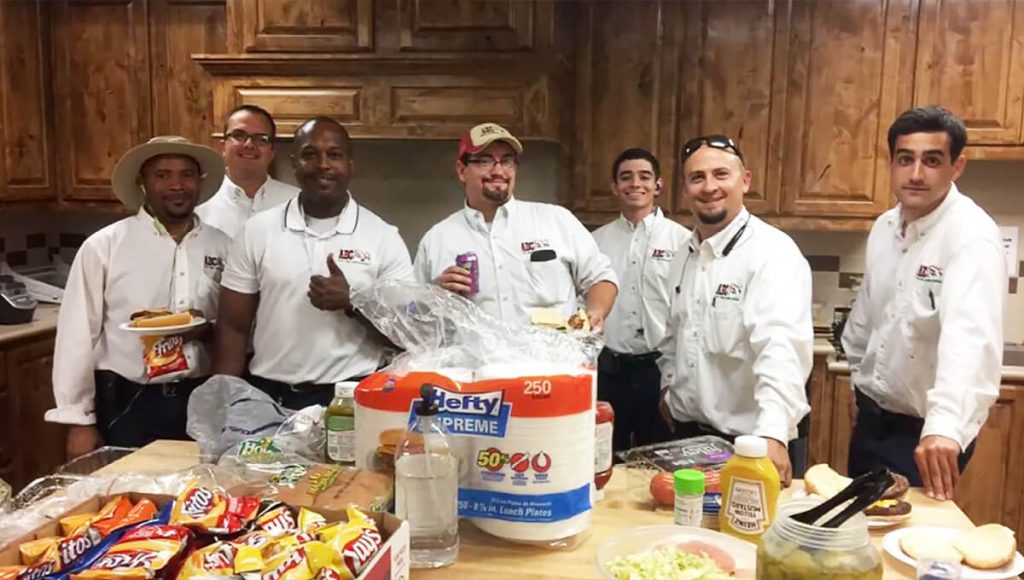 a group of ABC employees volunteering in a kitchen