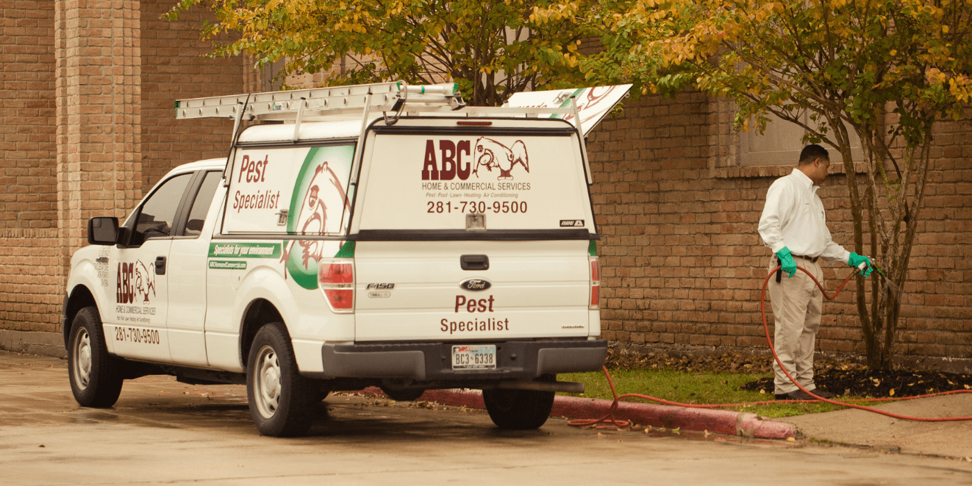 a pest control specialist treating an apartment complex for pests