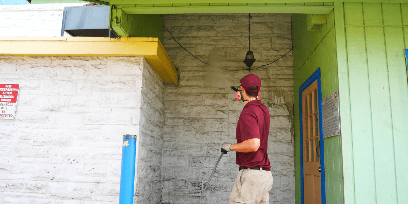 specialist power washing a restaurant